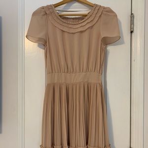 Cream colored dress. H&M. Size 4. Double layer skirt w/ ruffle detail. Side zip.